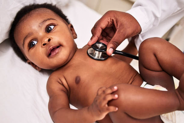 Shot of a little baby at a checkup with a doctor at a clinic, highlighting the importance of regular medical visits for healthy child growth.